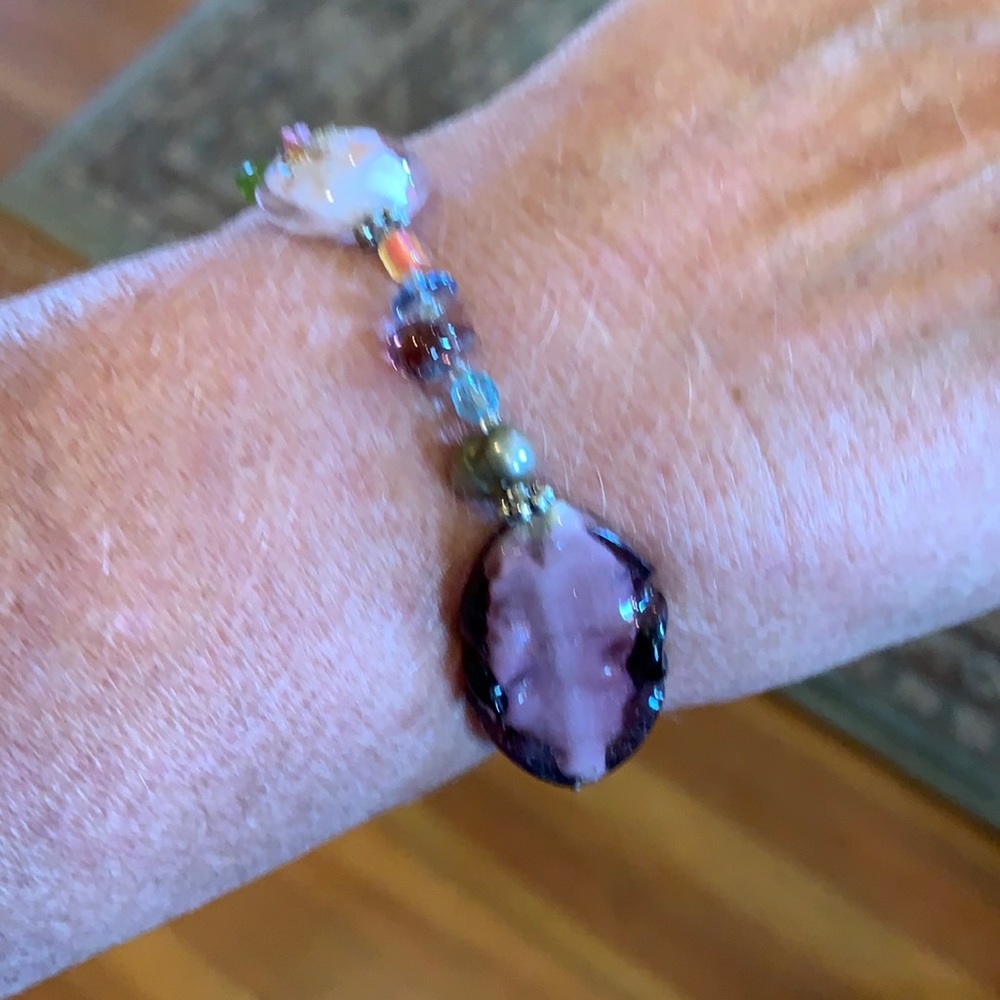 Beaded bracelet in purple, pink, and multi-colors